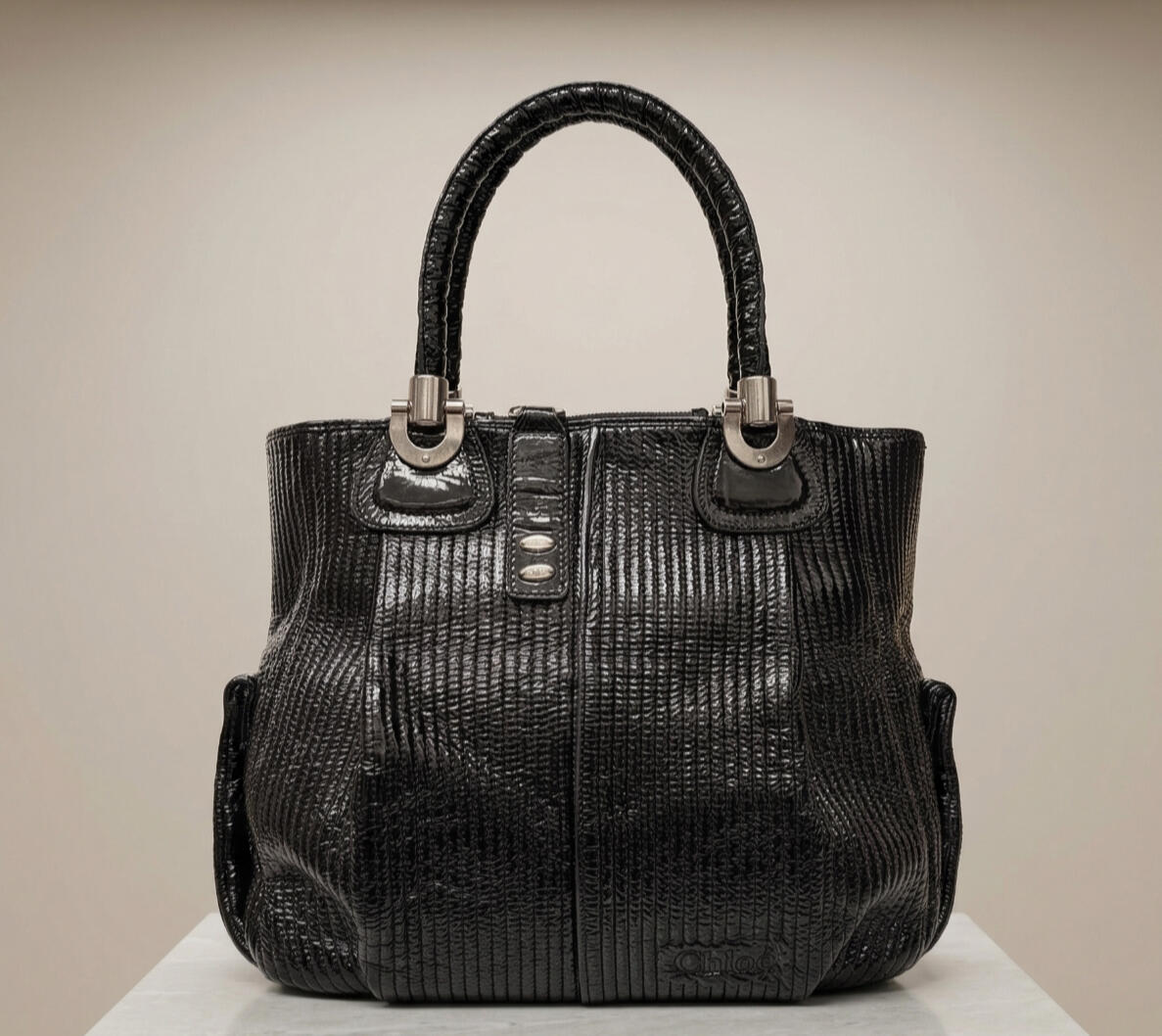 Luxurious black quilted patent leather Chloé Bay bag with heavy silver hardware.