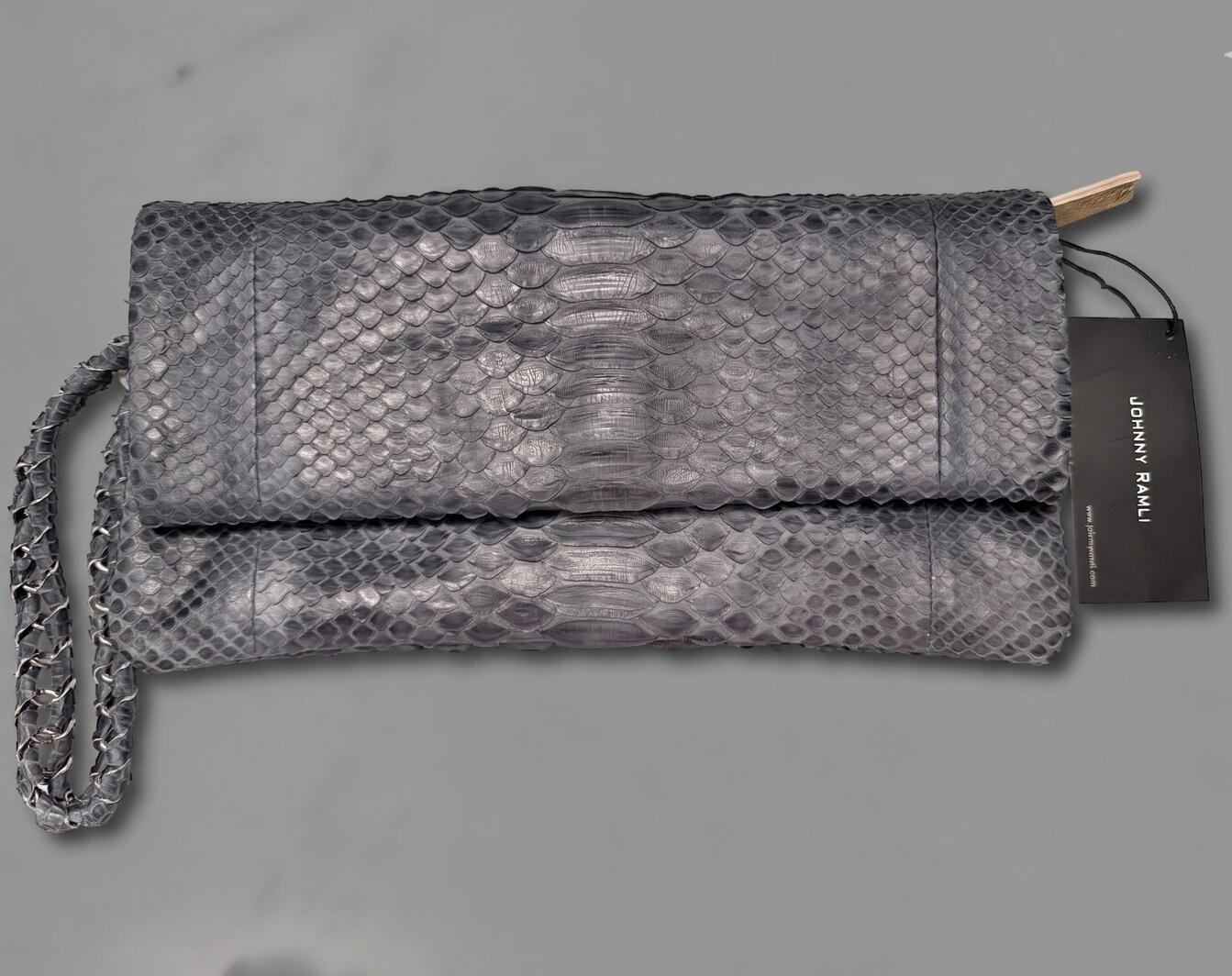 Exotic slate grey genuine python leather clutch by Johnny Ramli with gold leather interior.